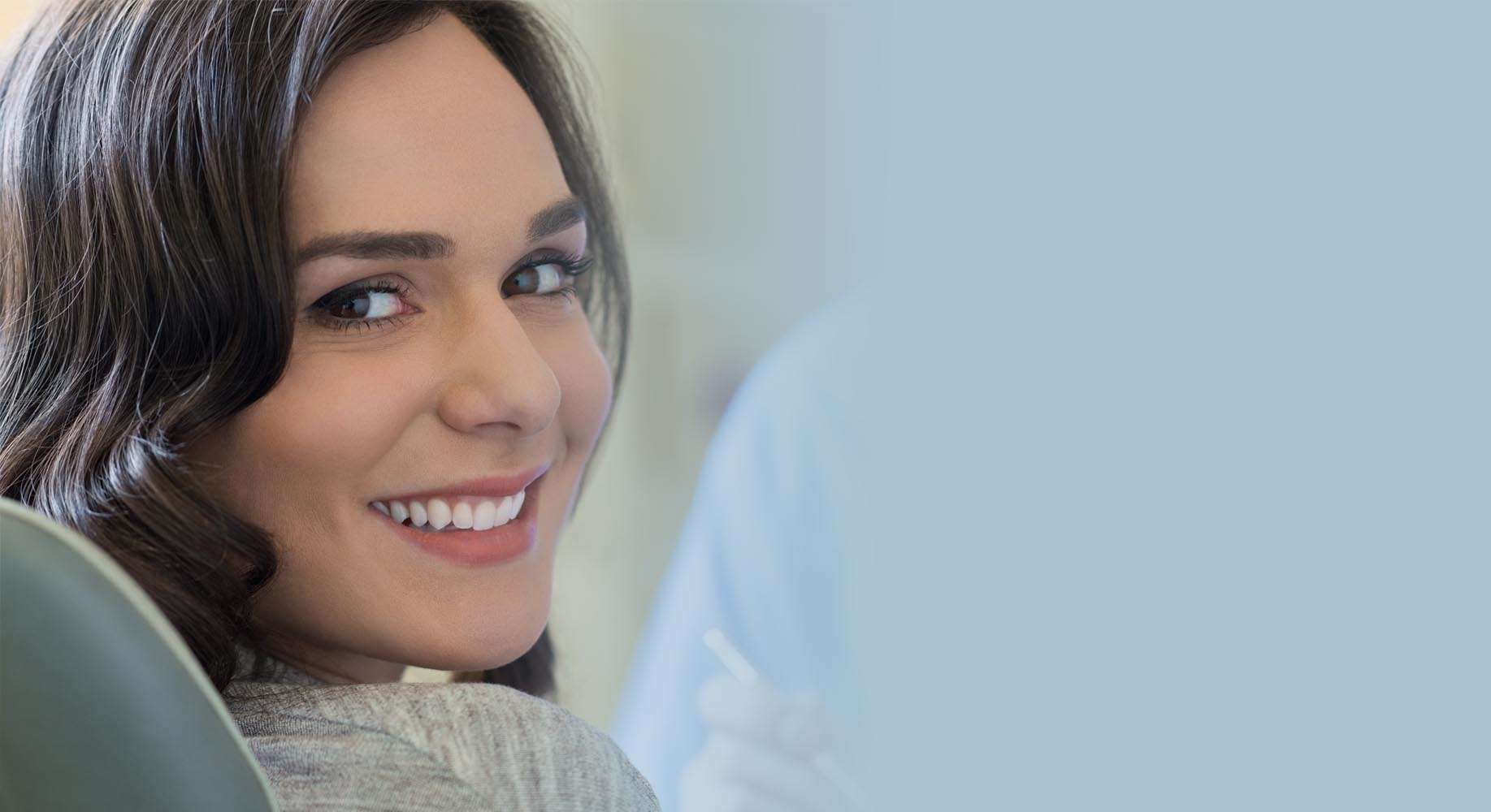 Smiling woman in a dental office setting